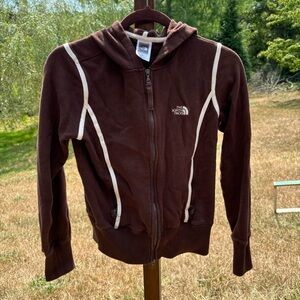 North Face zipper hoodie. Brown with white piping accents, size small very soft.